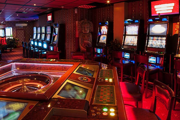 Live dealer managing multiple betting chips on baccarat table Live dealer managing multiple betting chips on baccarat table